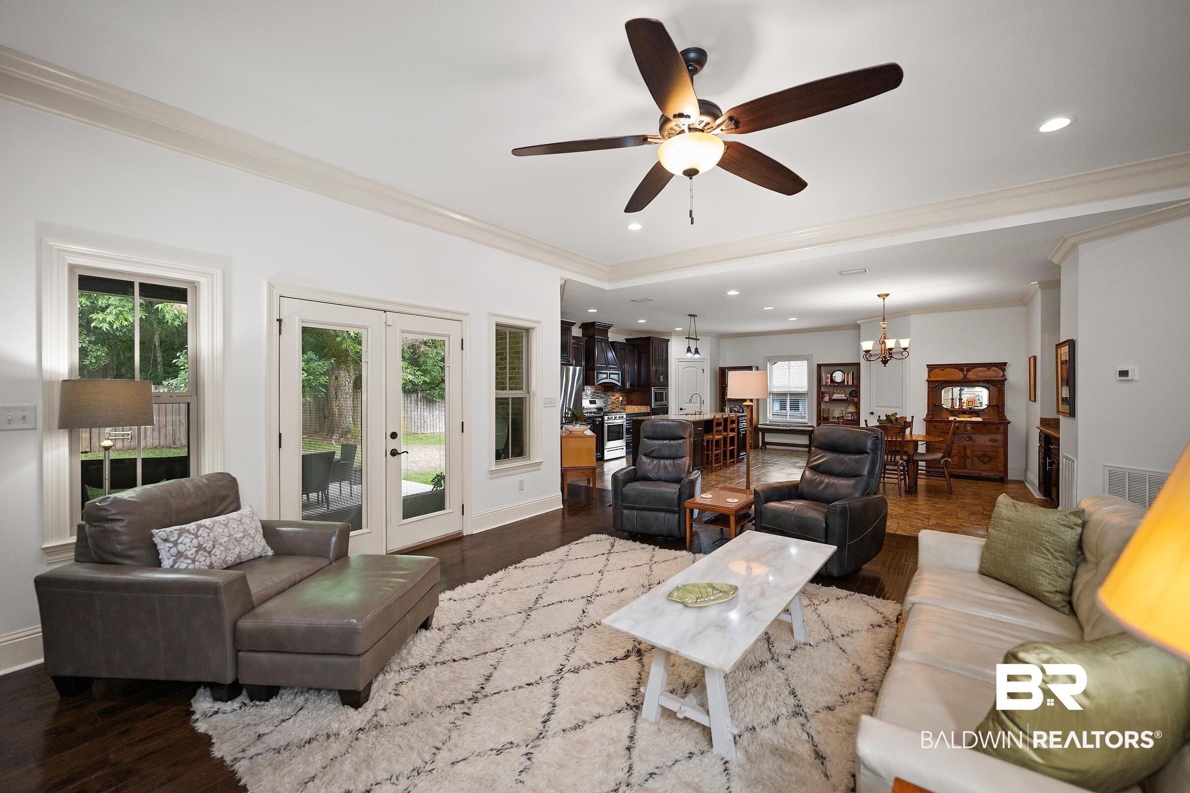 313 Pecan Ridge Boulevard Fairhope, AL 36532 - Photo 3 of 51 Living area featuring dark wood-finish flooring, white walls, and a ceiling fan