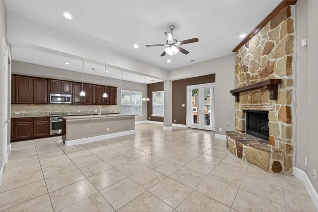 a view of livingroom with furniture flat screen tv and window