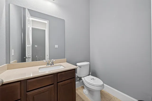 a kitchen with stainless steel appliances granite countertop wooden cabinets a granite counter tops and a window