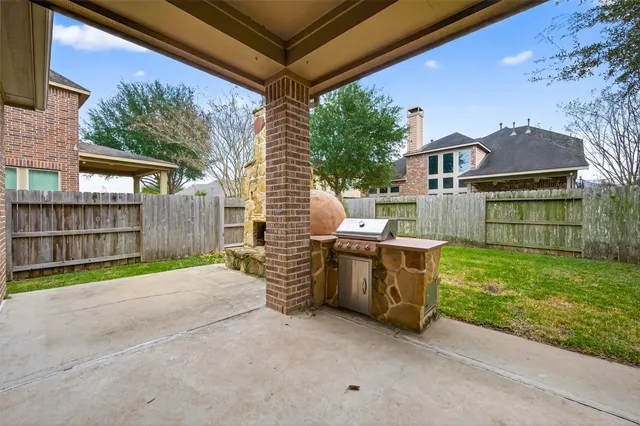 a view of a two chairs in the patio