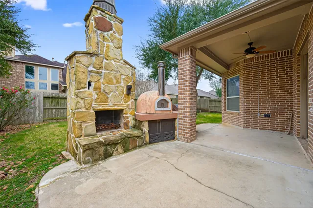 a view of a house with wooden fence