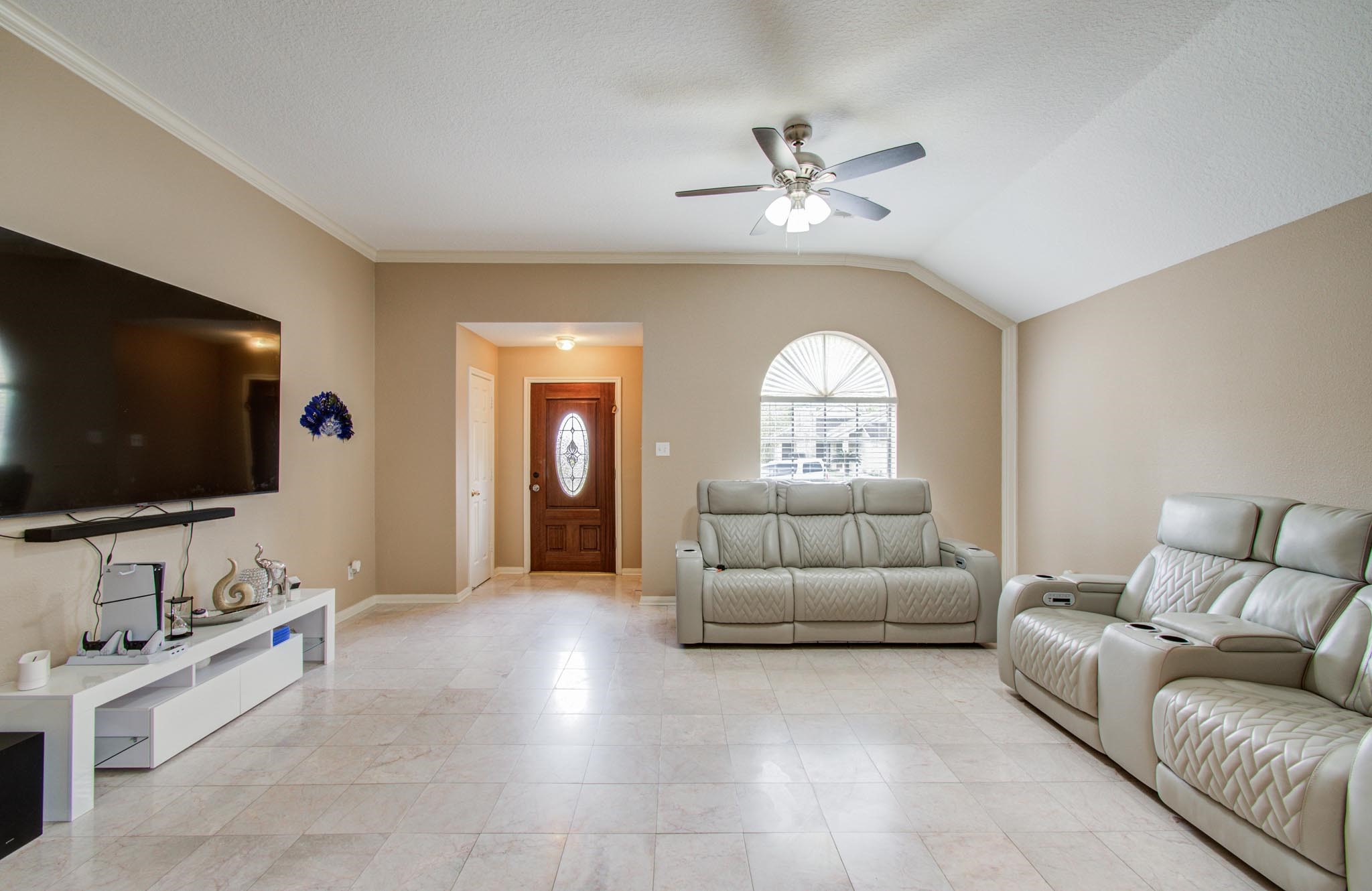 21074 Southern Colony Court Katy, TX 77449 - Photo 2 of 27 a living room with furniture and a flat screen tv