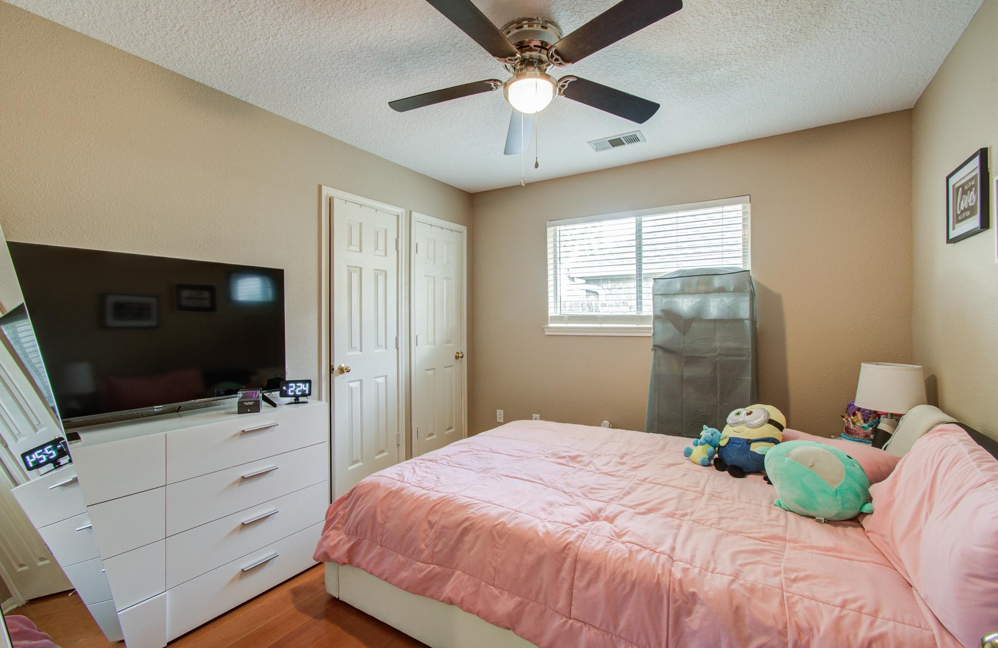 21074 Southern Colony Court Katy, TX 77449 - Photo 21 of 27 a bedroom with a bed and a flat screen tv