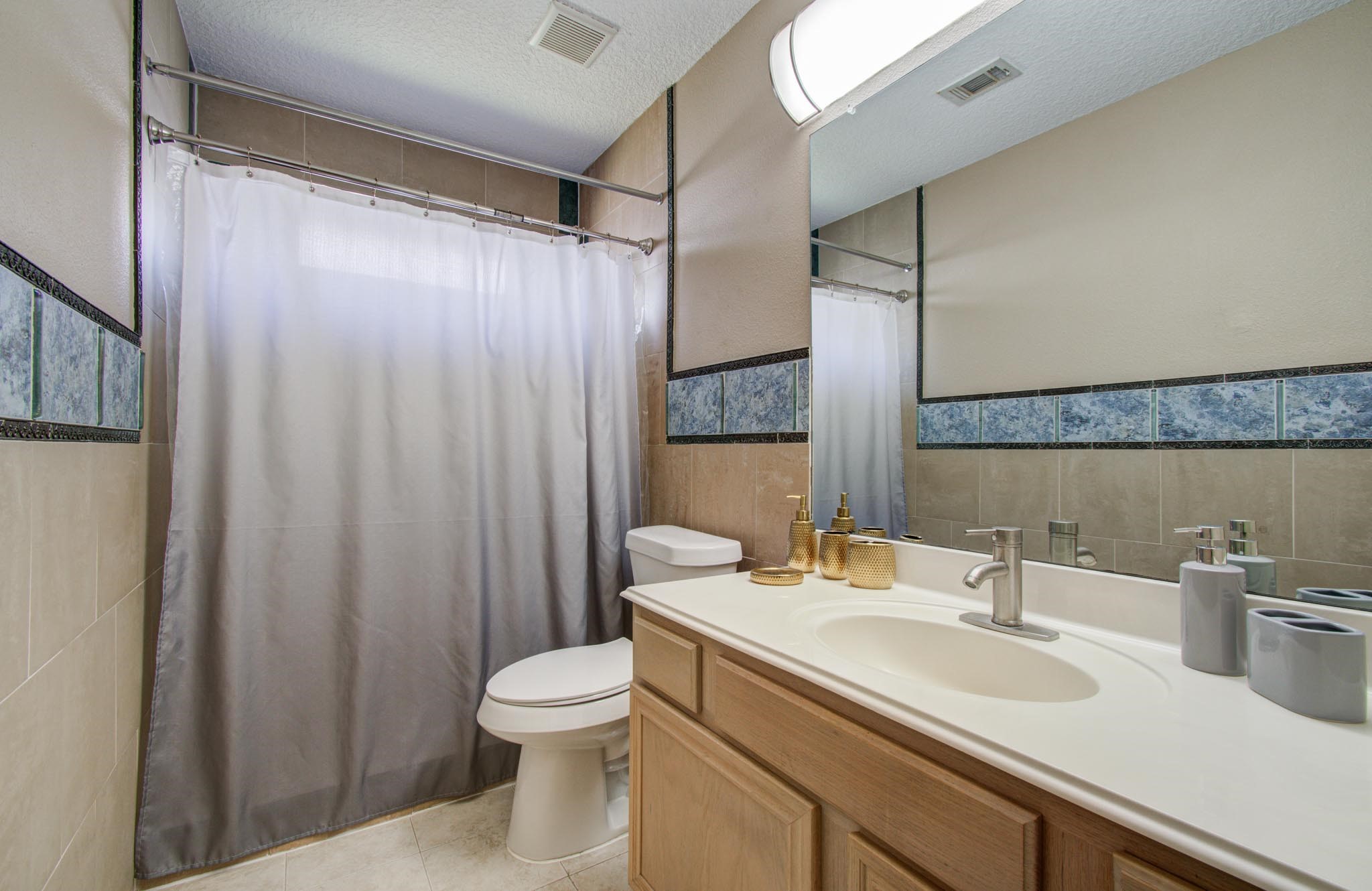 21074 Southern Colony Court Katy, TX 77449 - Photo 23 of 27 a bathroom with a sink a toilet and shower