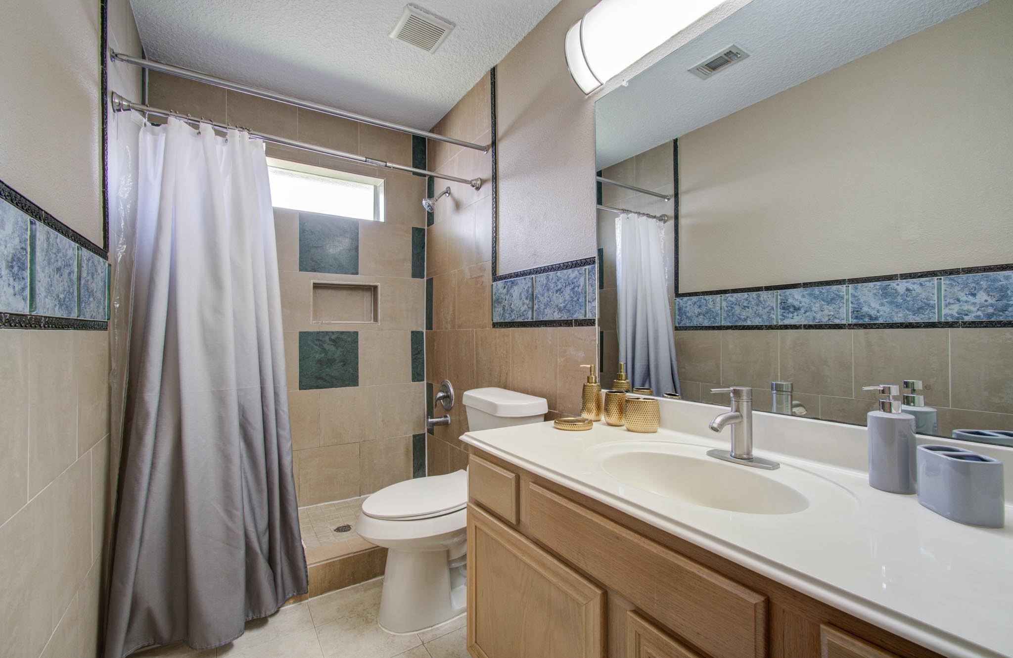 21074 Southern Colony Court Katy, TX 77449 - Photo 24 of 27 a bathroom with a sink toilet and shower