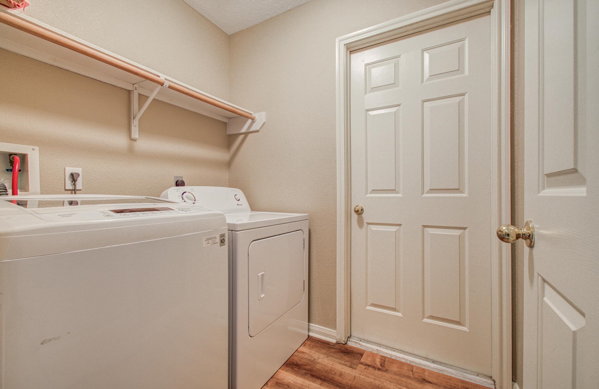 21074 Southern Colony Court Katy, TX 77449 - Photo 25 of 27 a utility room with dryer and washer