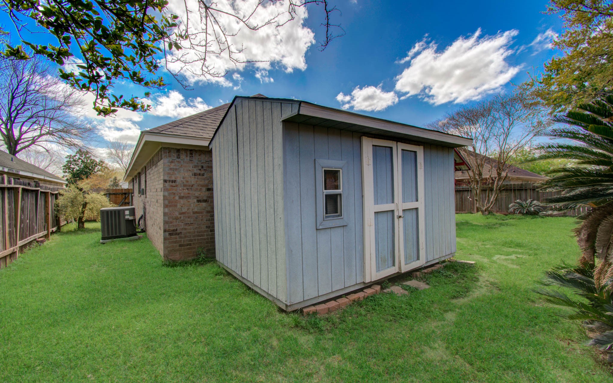 21074 Southern Colony Court Katy, TX 77449 - Photo 26 of 27 a backyard of a house with lots of green space