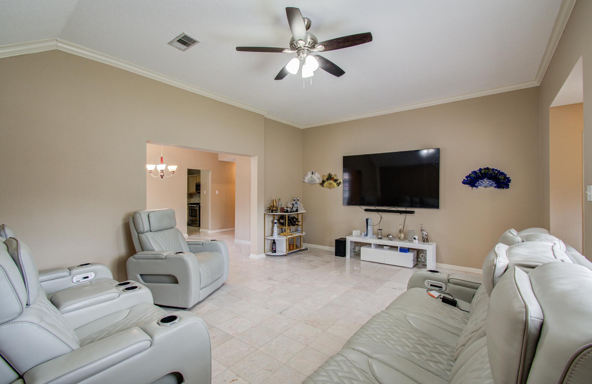 21074 Southern Colony Court Katy, TX 77449 - Photo 7 of 27 a living room with furniture and a flat screen tv