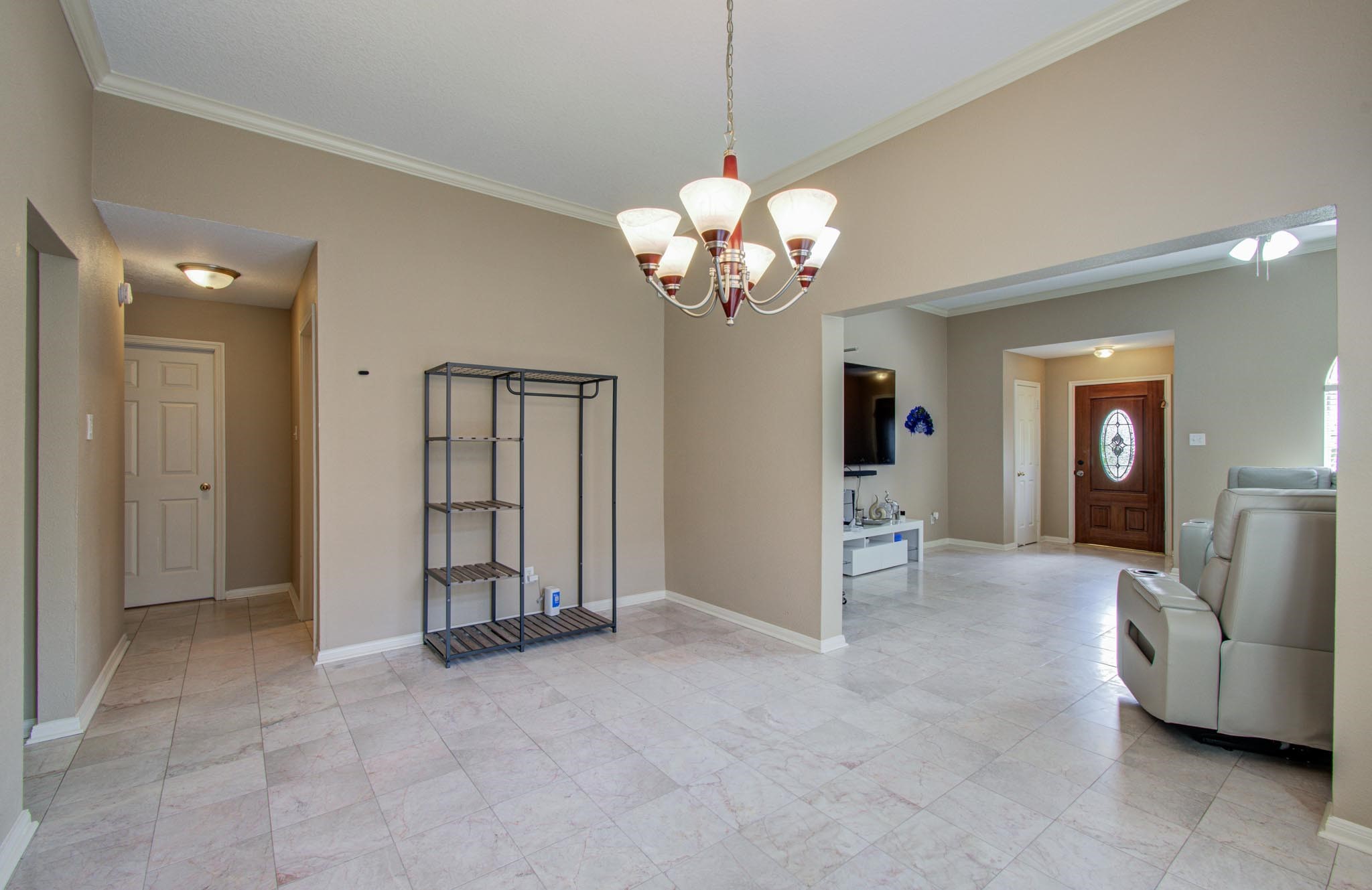 21074 Southern Colony Court Katy, TX 77449 - Photo 9 of 27 a view of a livingroom with a chandelier furniture and windows