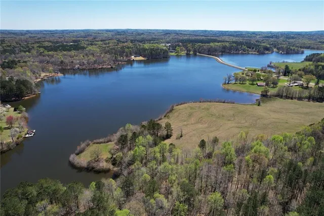 an aerial view of a house with a lake view