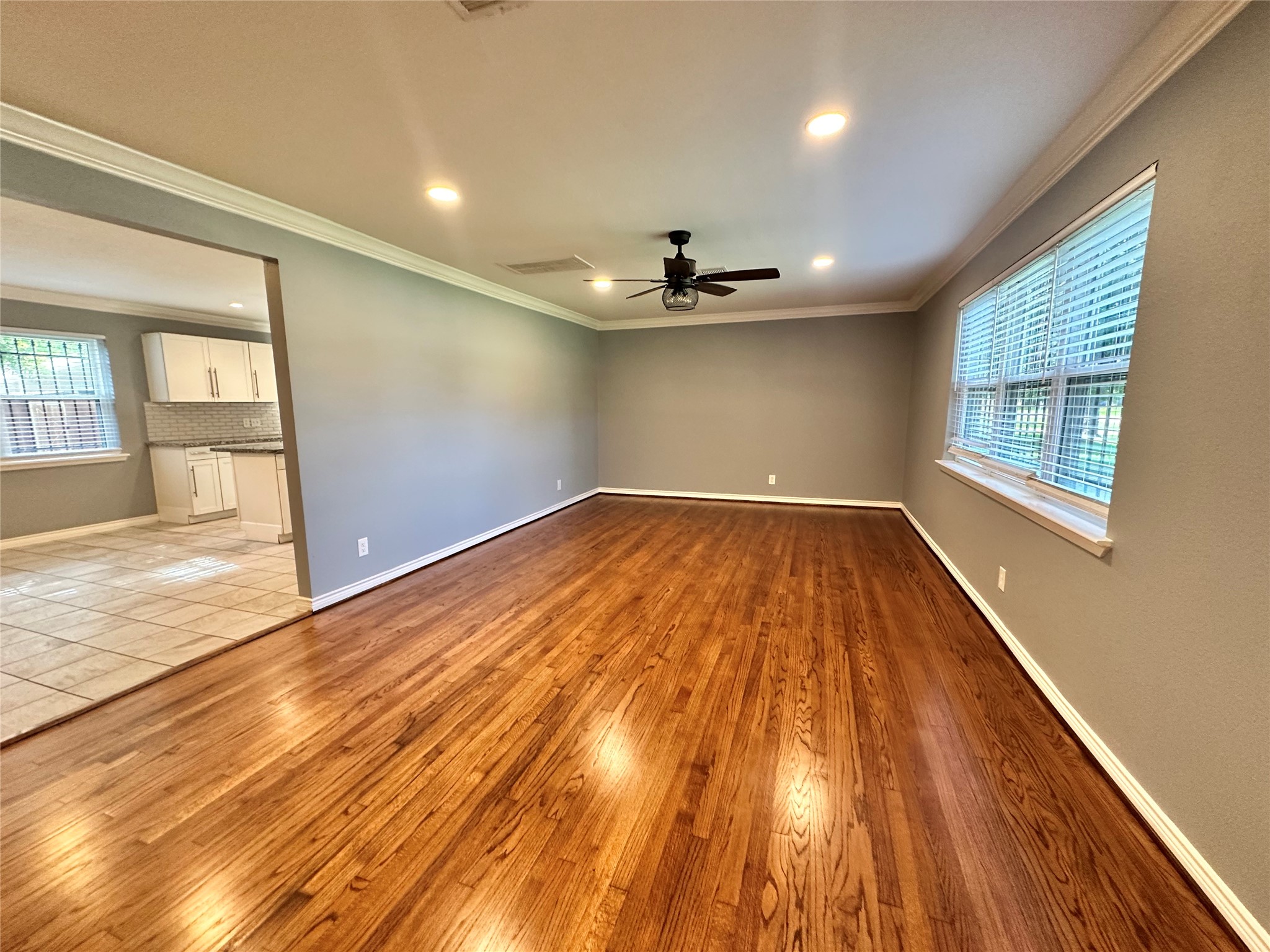 2206 South Houston Road Pasadena, TX 77502 - Photo 6 of 11 a view of empty room with wooden floor and fan