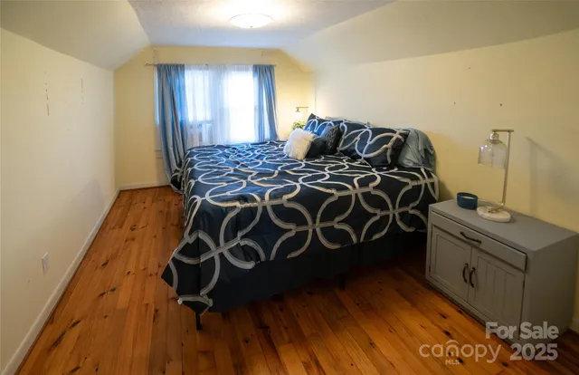 a bathroom with a toilet a sink and a mirror