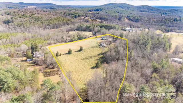 a view of a house with a mountain and trees