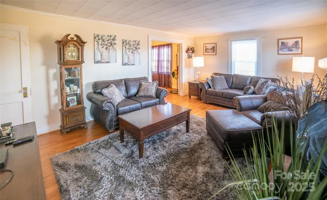 a living room with furniture and a rug