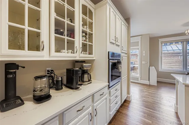 a kitchen with cabinets and window
