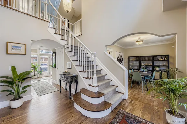 a view of entryway and hall with wooden floor