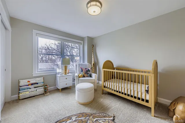 a bedroom with furniture and a window