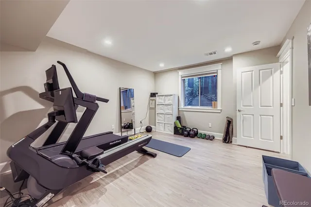 a living room with gym equipment