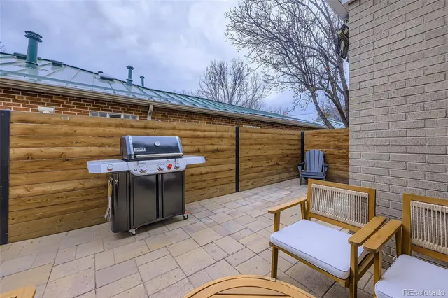 a view of a chairs and table in the patio