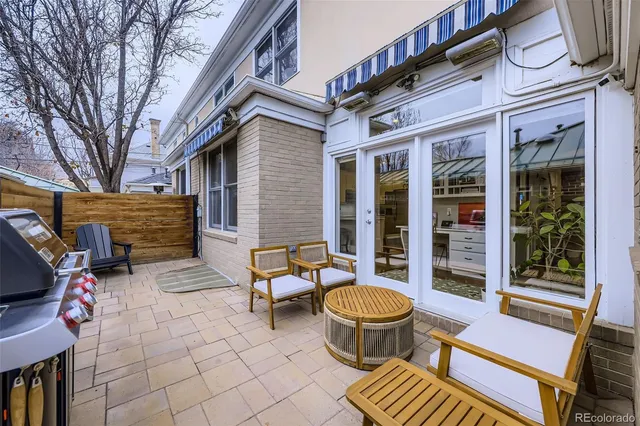 a backyard of a house with outdoor seating