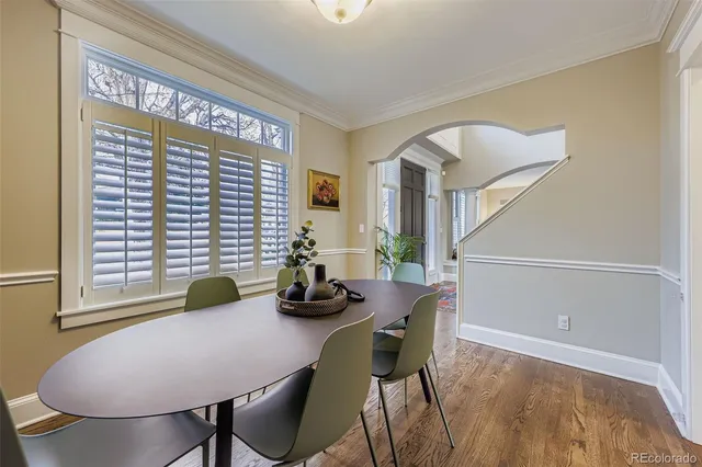 a view of a dining room with furniture and window