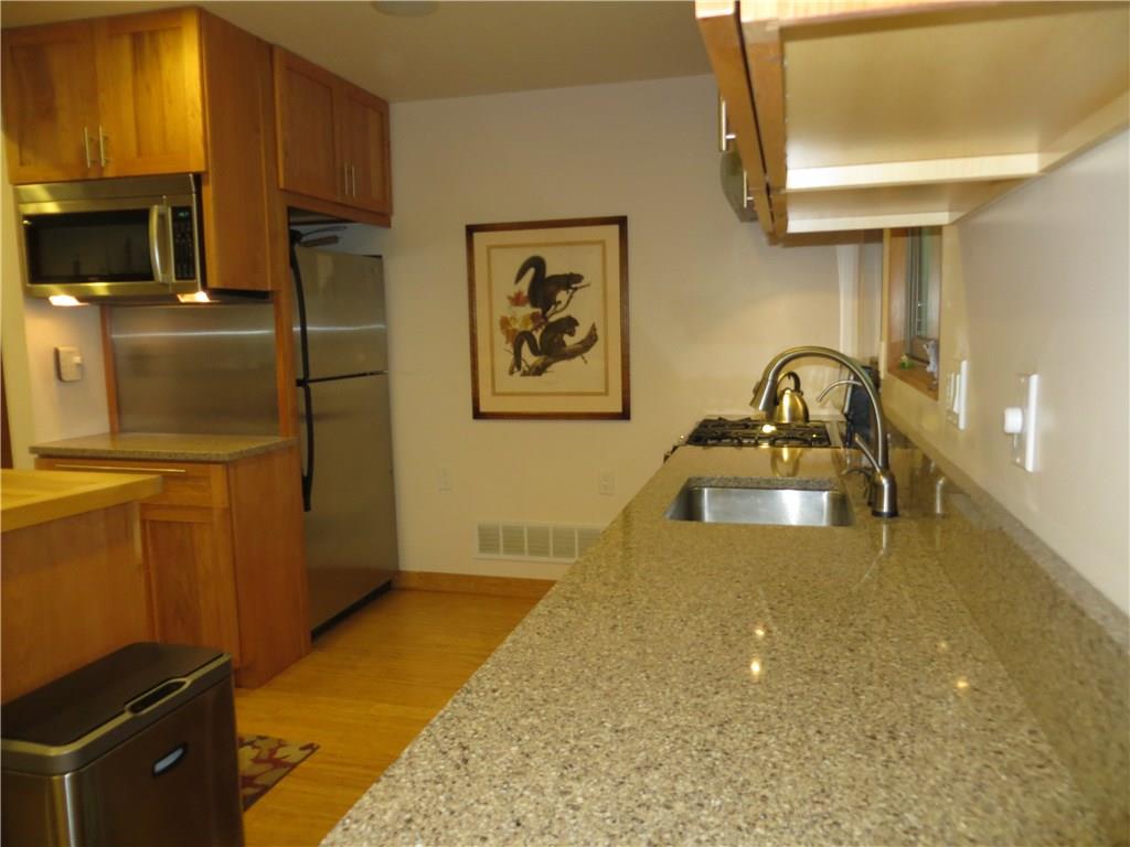 128 Upper Service Road Hookstown, PA 15050 - Photo 4 of 19 Lots of Work Space in this Gourmet Kitchen. Bosch Microwave and SS Whirlpool Refrigerator Complete this Lovely Kitchen.