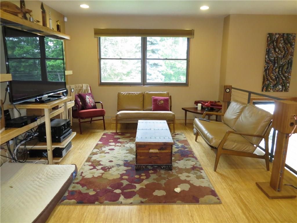 128 Upper Service Road Hookstown, PA 15050 - Photo 8 of 19 Living Room w/Custom Built Bamboo Shelving to match flooring.