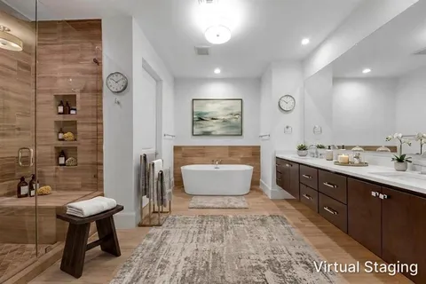 a bathroom with a sink a toilet and bathtub
