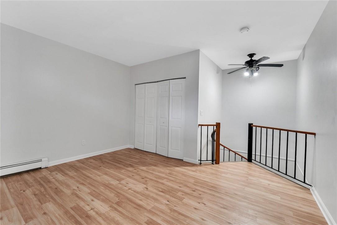 wooden floor in a hall with a window
