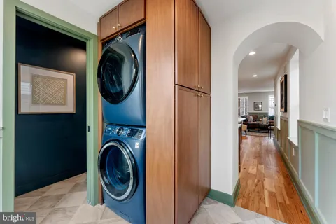a view of a hallway with washer and dryer