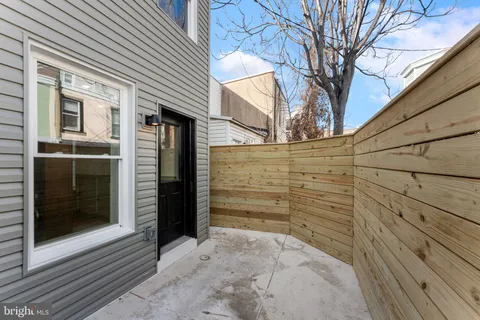 a view of door and wooden house