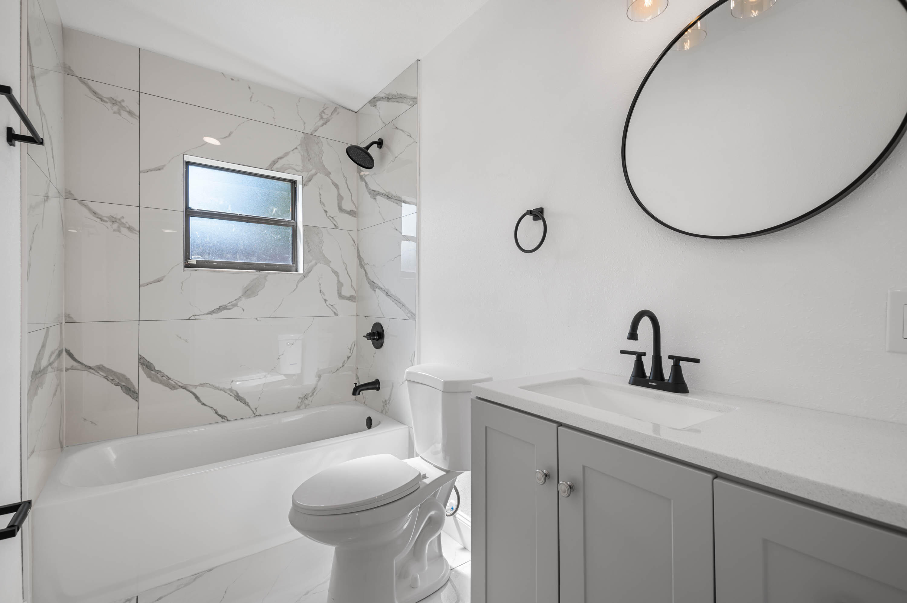 515 A Lane Cocoa, FL 32926 - Photo 20 of 31 a bathroom with a sink a toilet and a mirror