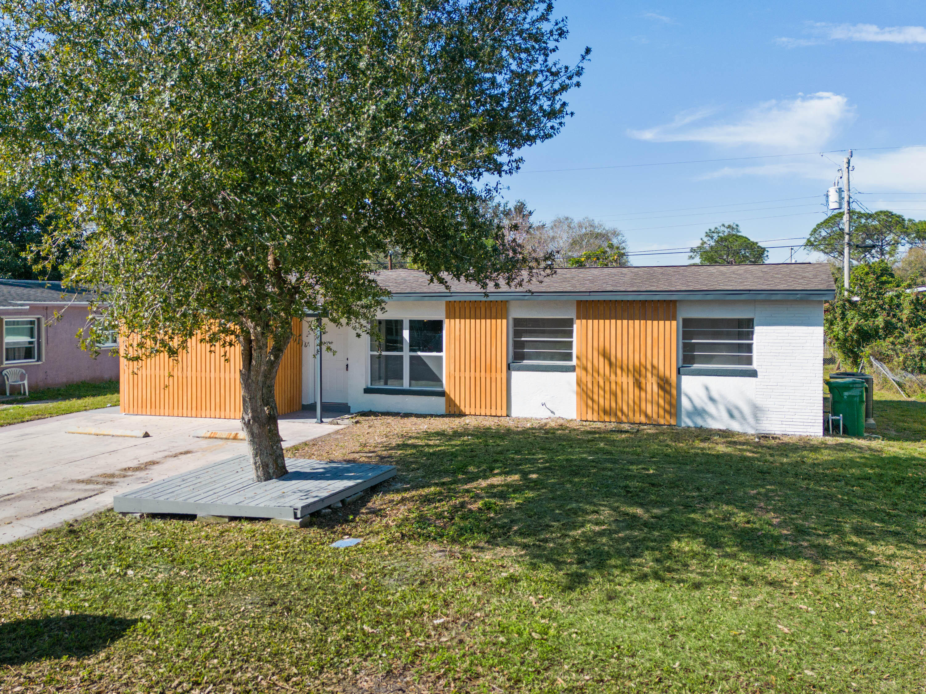 515 A Lane Cocoa, FL 32926 - Photo 2 of 31 a front view of a house with a yard and garage