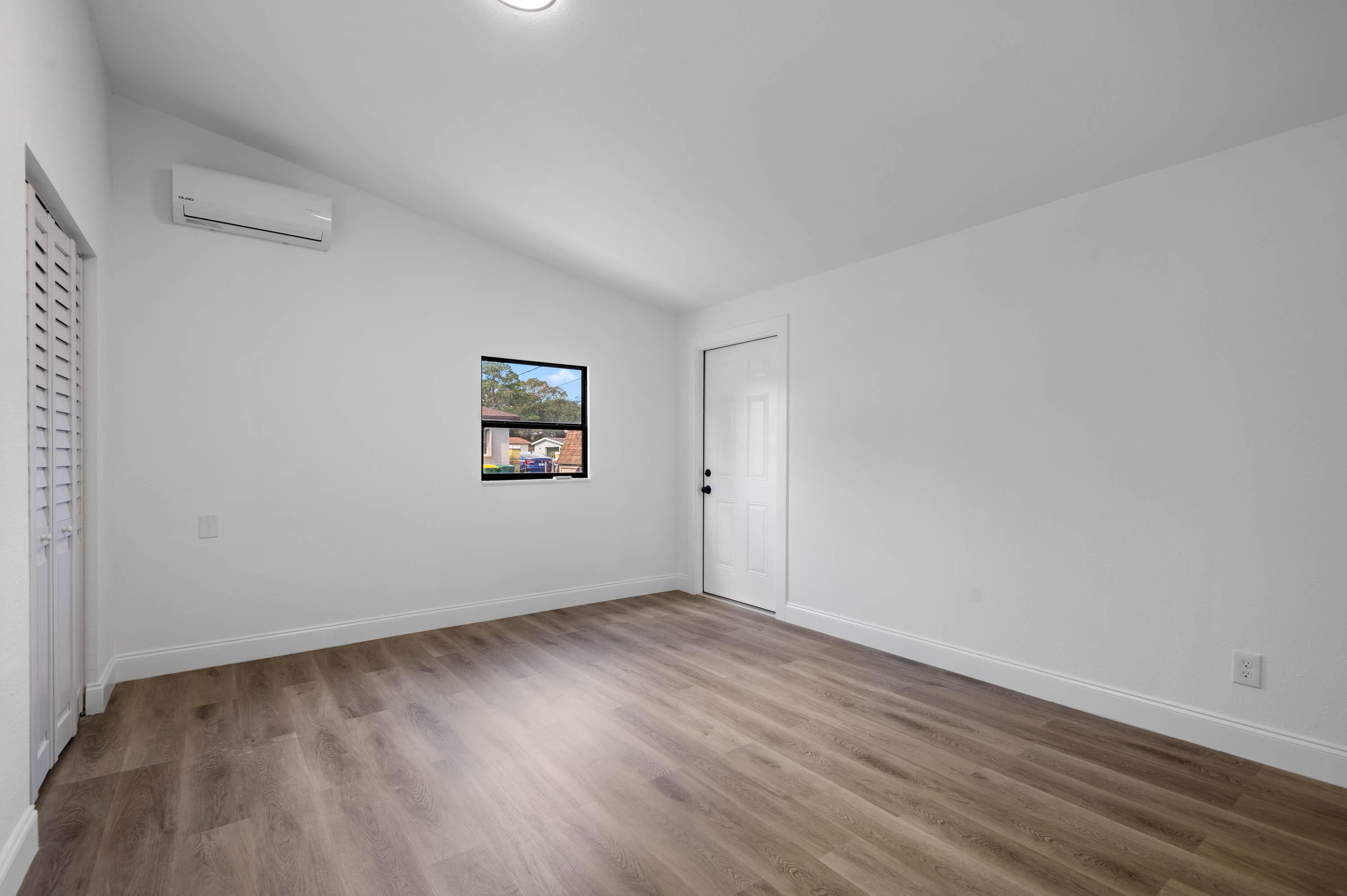 515 A Lane Cocoa, FL 32926 - Photo 22 of 31 a view of an empty room with wooden floor