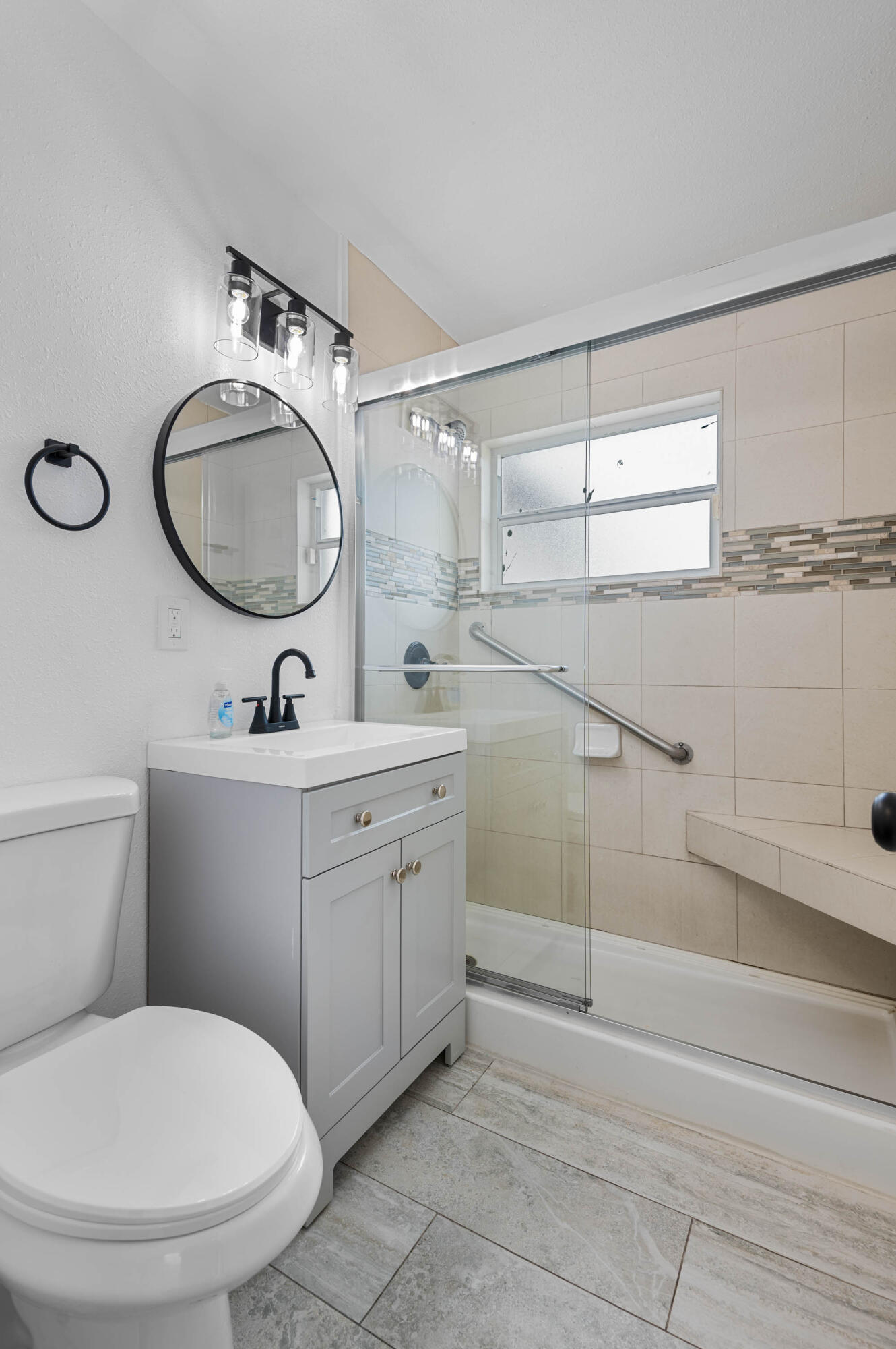 515 A Lane Cocoa, FL 32926 - Photo 25 of 31 a bathroom with a toilet sink and mirror