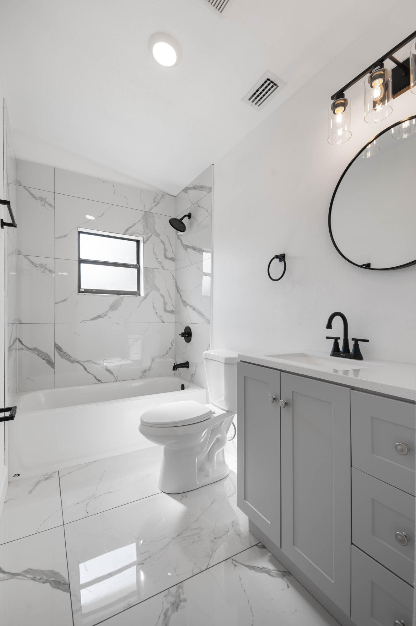 515 A Lane Cocoa, FL 32926 - Photo 26 of 31 a bathroom with a toilet sink and mirror