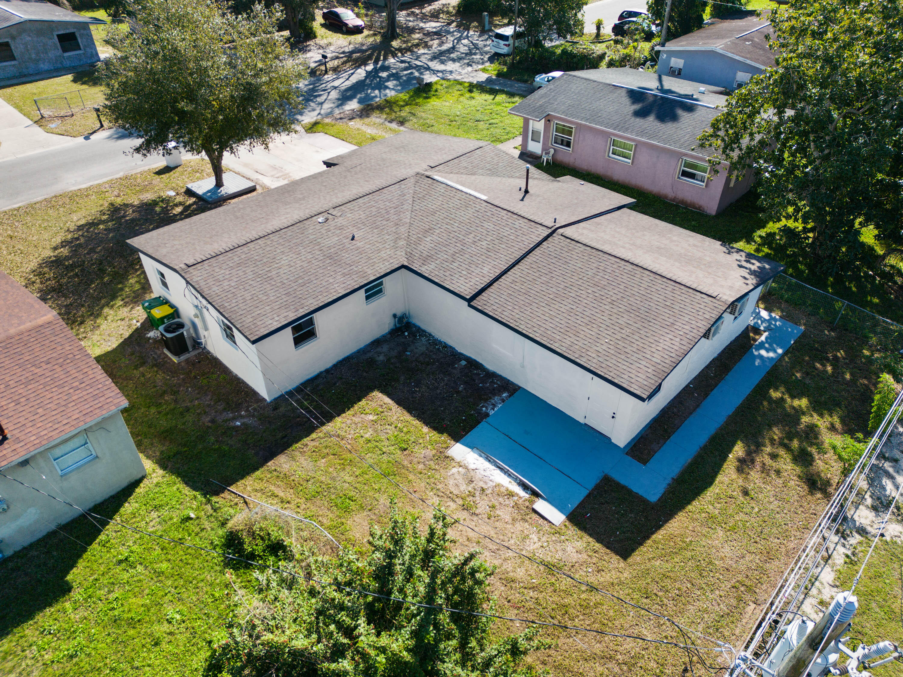 515 A Lane Cocoa, FL 32926 - Photo 28 of 31 an aerial view of multiple houses with a yard