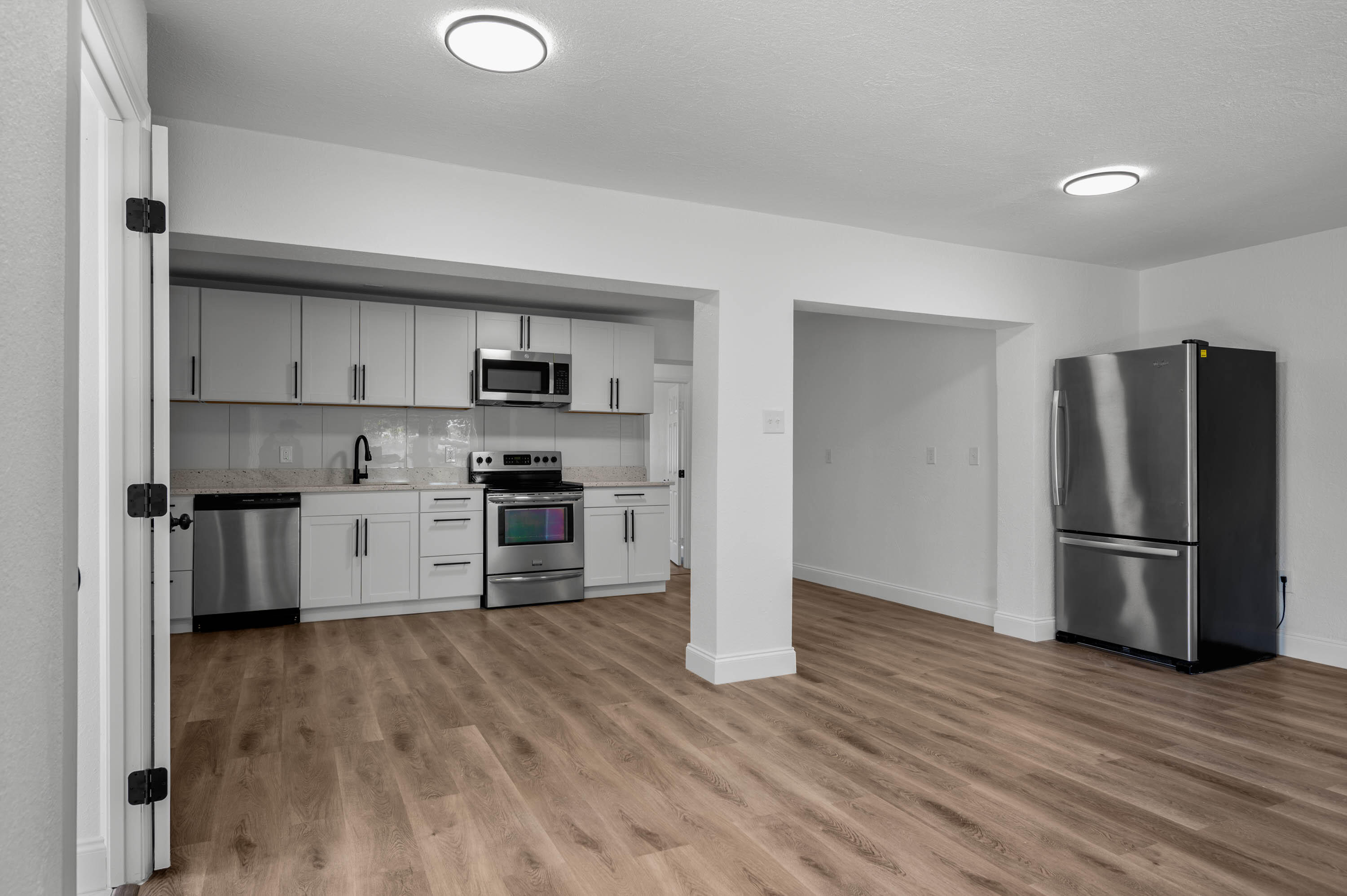 515 A Lane Cocoa, FL 32926 - Photo 7 of 31 a kitchen with a refrigerator and a stove top oven