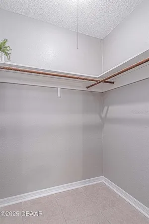 an aerial view of a house with a garden and trees