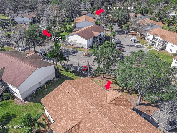 an aerial view of house with yard