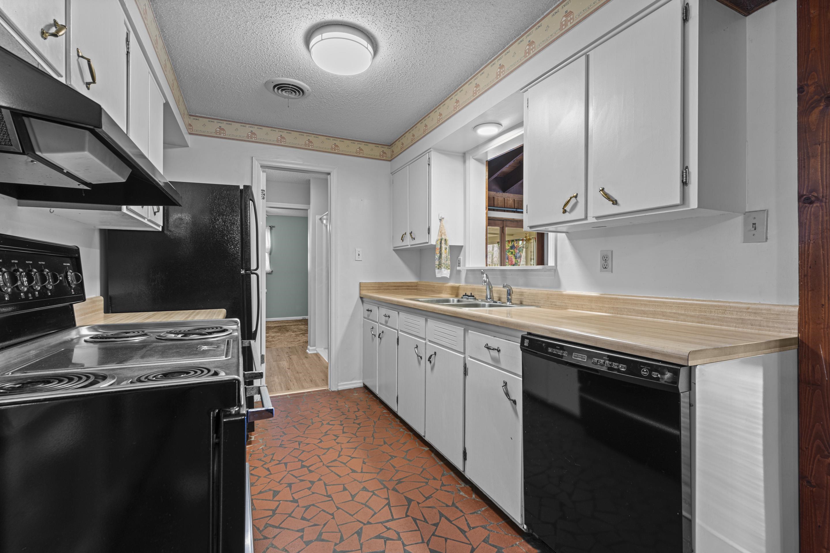 319 Homeville Road Collierville, TN 38017 - Photo 7 of 21 a kitchen with stainless steel appliances granite countertop a stove and a sink