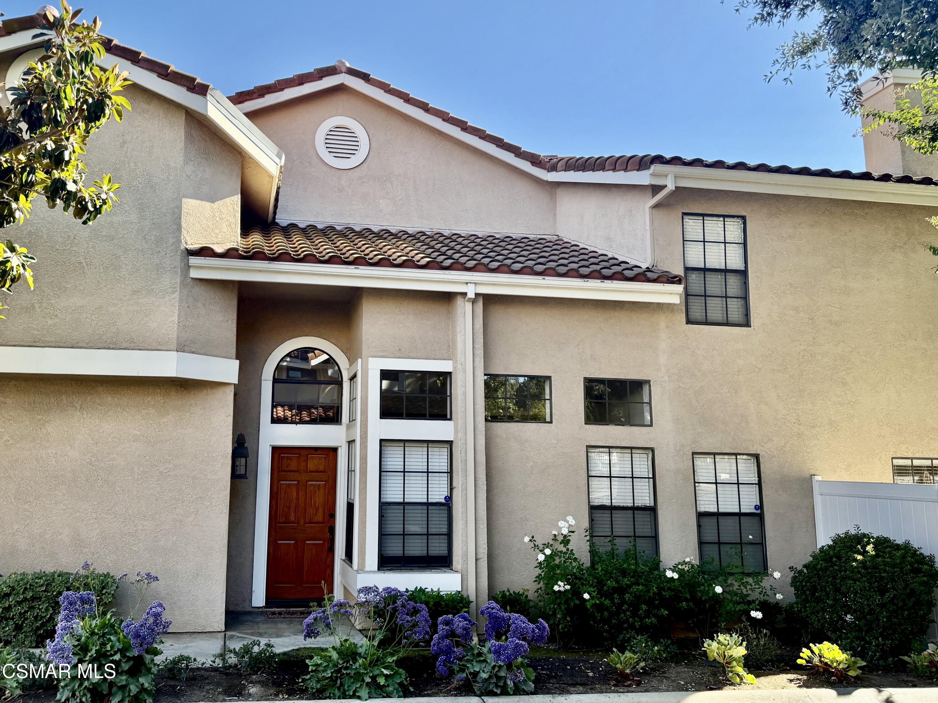 429 Dante Way Oak Park, CA 91377 - Photo 1 of 18 a front view of a house with plants