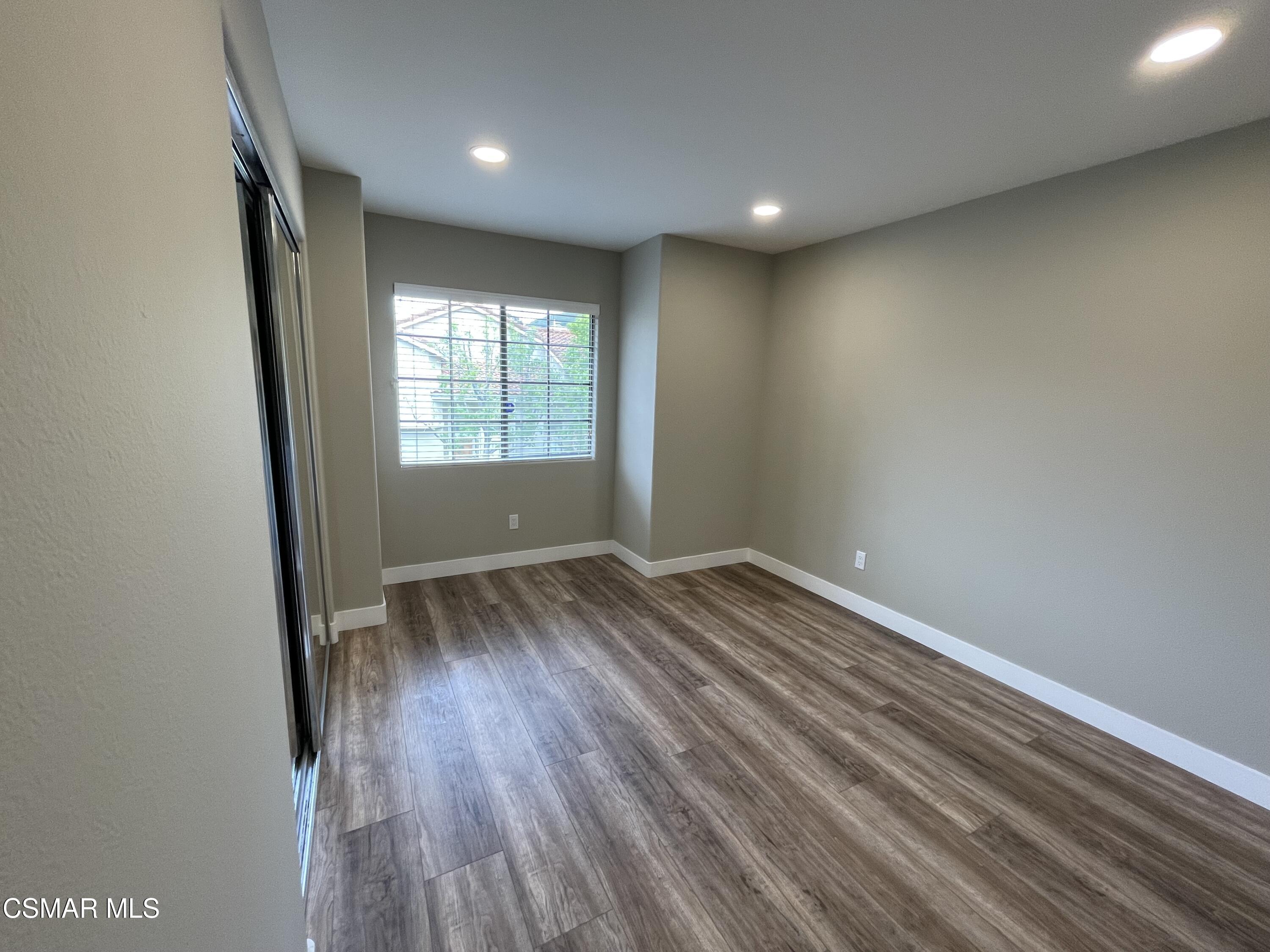 429 Dante Way Oak Park, CA 91377 - Photo 14 of 18 an empty room with wooden floor and window