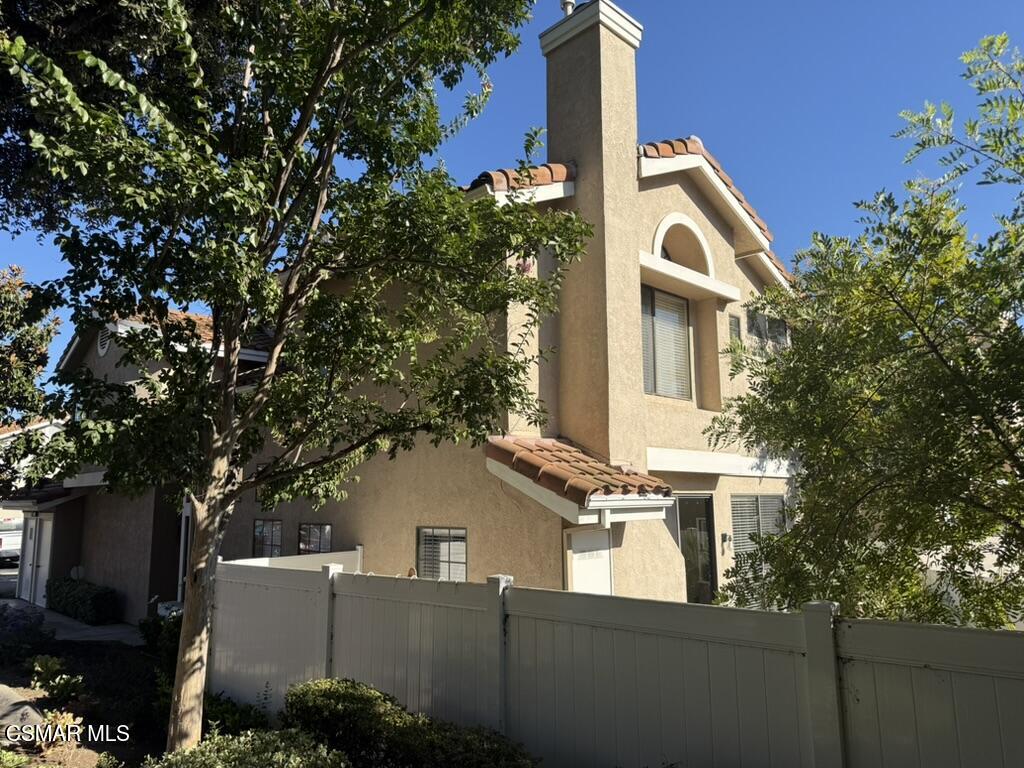 429 Dante Way Oak Park, CA 91377 - Photo 3 of 18 a view of a house with a tree