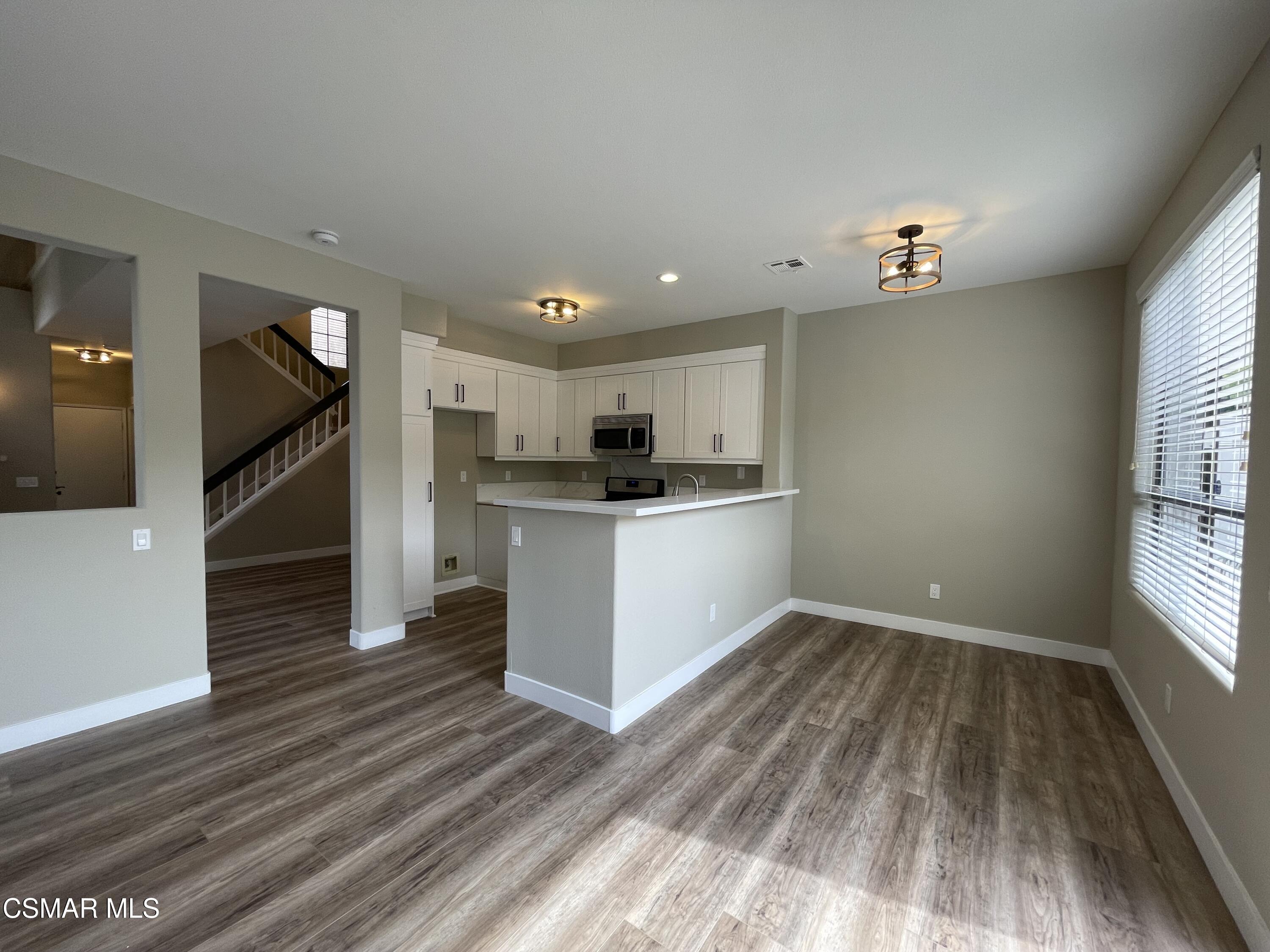 429 Dante Way Oak Park, CA 91377 - Photo 6 of 18 a view of kitchen with wooden floor and electronic appliances