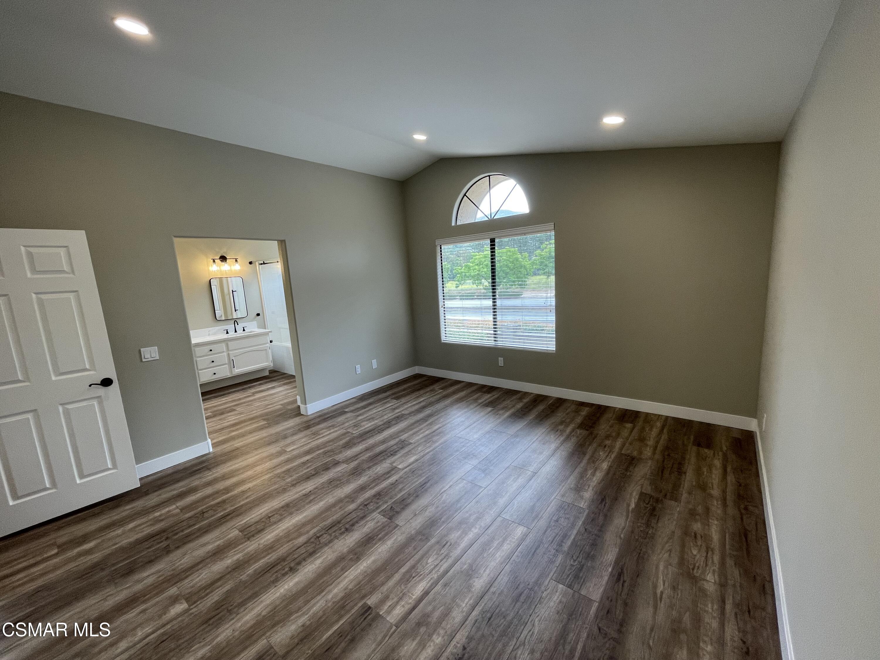 429 Dante Way Oak Park, CA 91377 - Photo 10 of 18 an empty room with wooden floor and windows