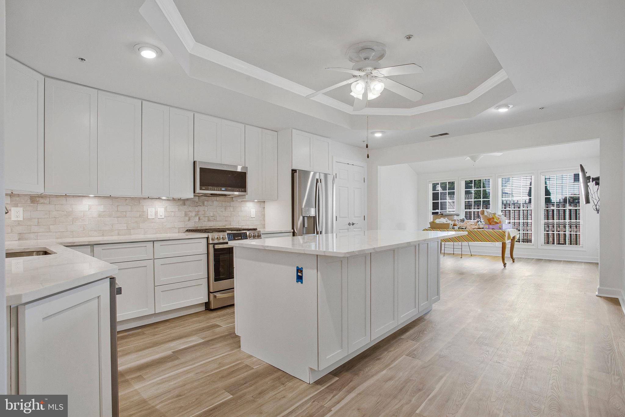 322 Hamlet Circle Edgewater, MD 21037 - Photo 2 of 21 a view of kitchen with stainless steel appliances sink stove refrigerator and cabinets