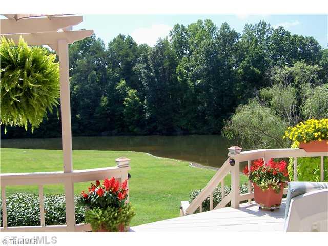 6102 Pintail Court Oak Ridge, NC 27310 - Photo 1 of 16 Exterior Back. You ll enjoy hours of relaxation and stunning views of the pond from the deck.