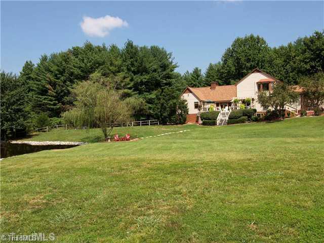 6102 Pintail Court Oak Ridge, NC 27310 - Photo 2 of 16 Exterior Back. Private and quite. Wild life haven.