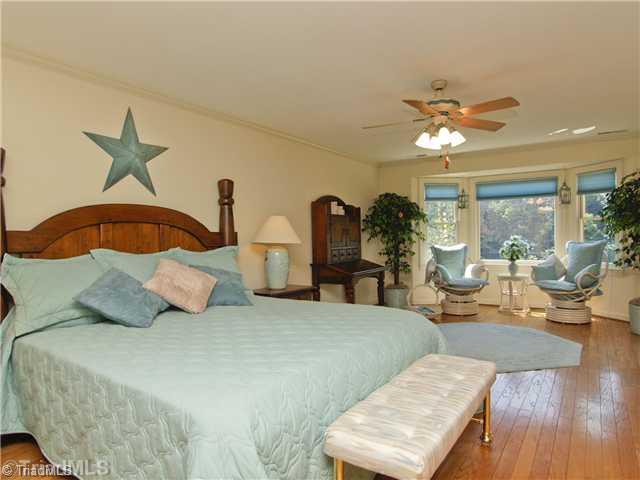 6102 Pintail Court Oak Ridge, NC 27310 - Photo 12 of 16 Master Bedroom. Private Master Suite with 750 square foot. Amenties include his and her closets, wood floors, bay window perfect for reading your favorite book and or winding down before bedtime.